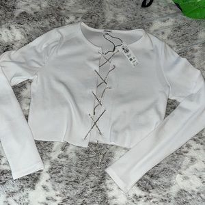 White ribbed top, open front with crystal weaves. NEW WITH TAGS